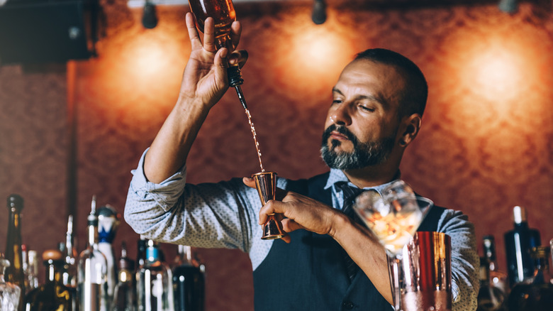 A bartender preparing a cocktail