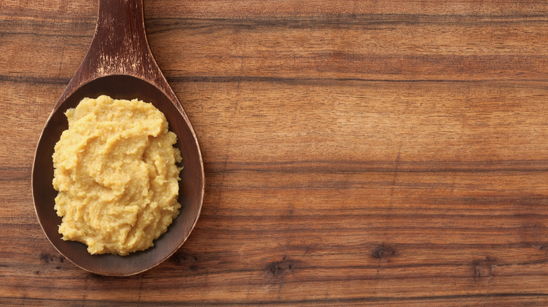 A wooden spoonful of miso.