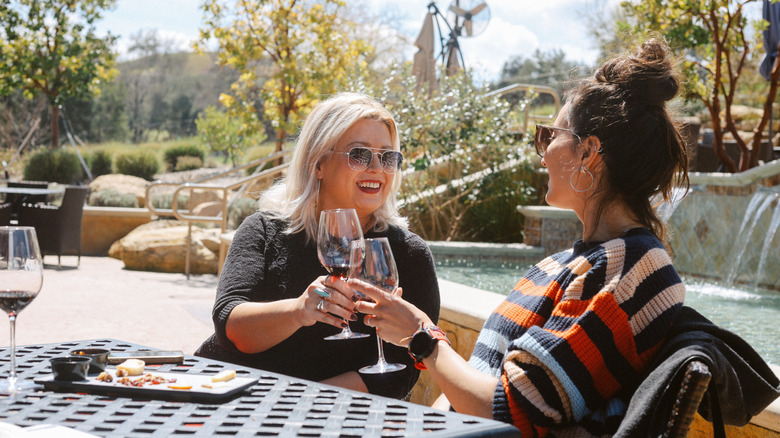 people tasting wine together