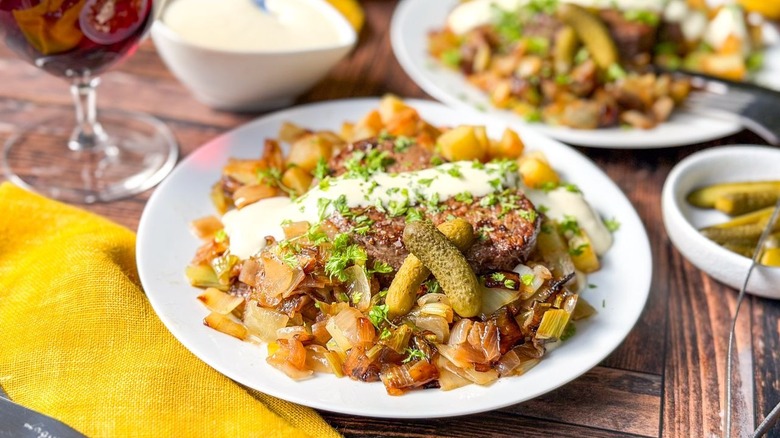 Beef Rydberg-style steak and potatoes on serving plate on table