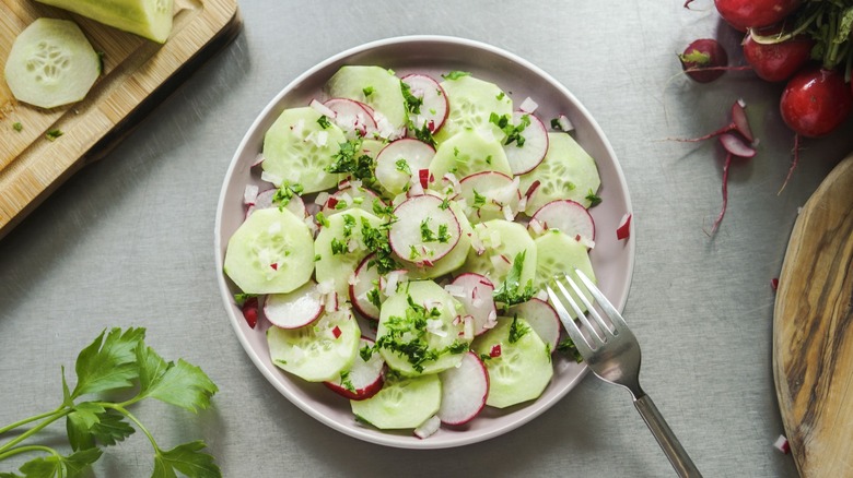 A plate of cucumber and radish salad