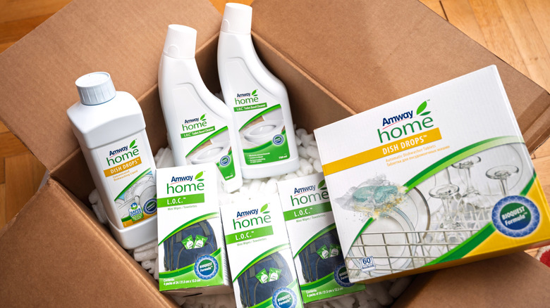 Amway cleaning products in an open cardboard box