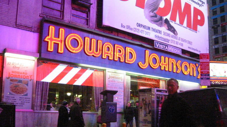 A neon-lit Howard Johnson's sign in New York's Times Square