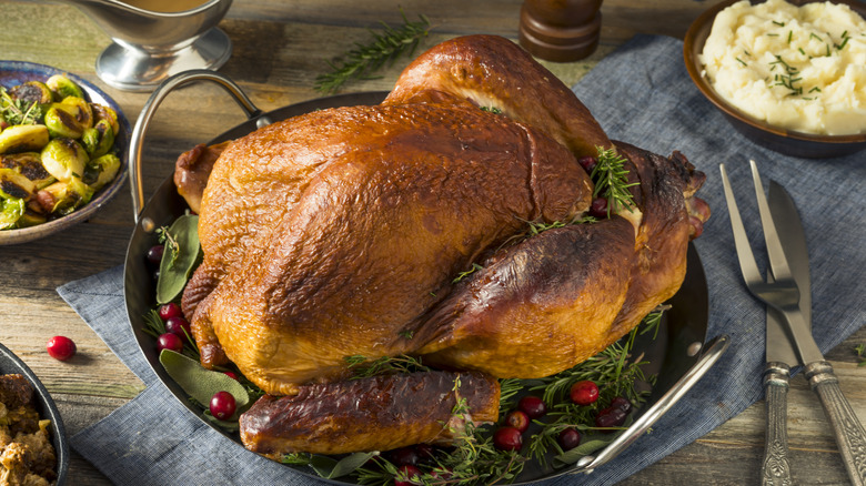 Cooked turkey on dinner table.