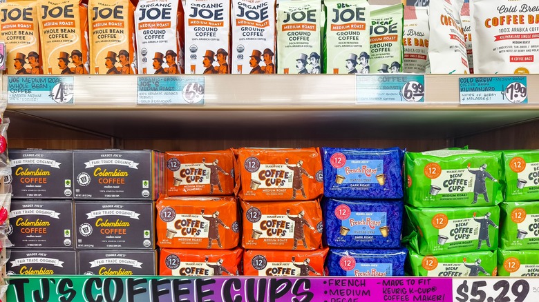 Grocery store shelves full of bags of Trader Joe's coffee