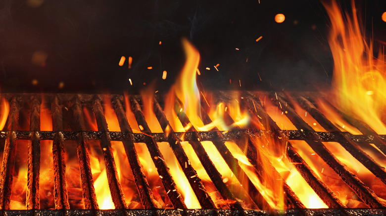 Fire beneath grill grate