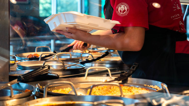 Panda express employee serving food