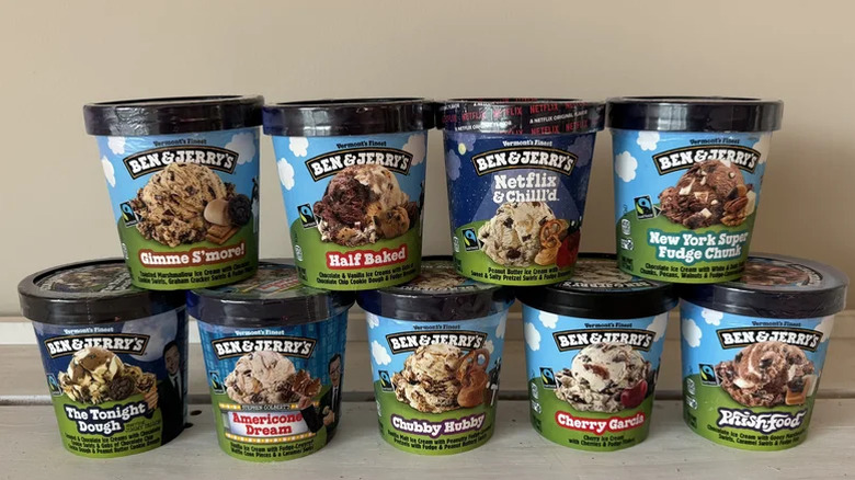 A series of Ben and Jerry's ice cream tubs lined up next to each other.