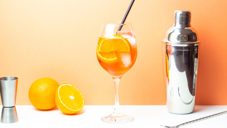 an Aperol spritz and bartending equipment