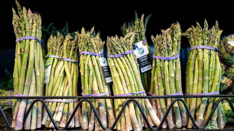 Asparagus sits on a grocery store shelf