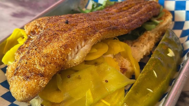 Fishmonger's open-faced hot fish sandwich loaded with flavorful fillings.