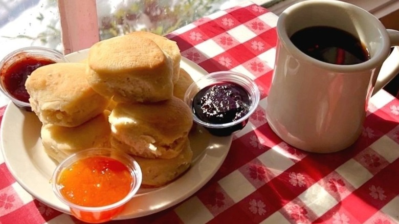 A plate of biscuits with spreads and a cup of coffee at Loveless Cafe