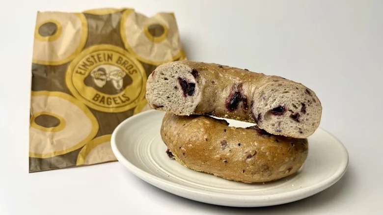 An Einstein Bros. Bagels blueberry bagel cut in half