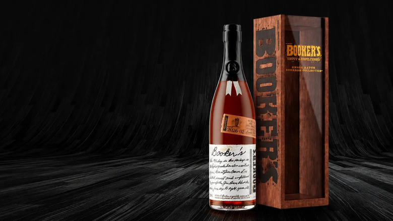 A bottle of Booker's bourbon next to a wooden box