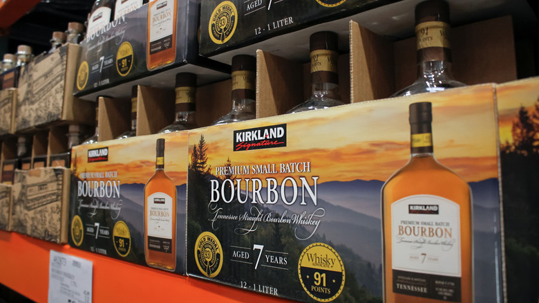 Bottles of Kirkland Signature Small Batch Bourbon on a shelf at Costco