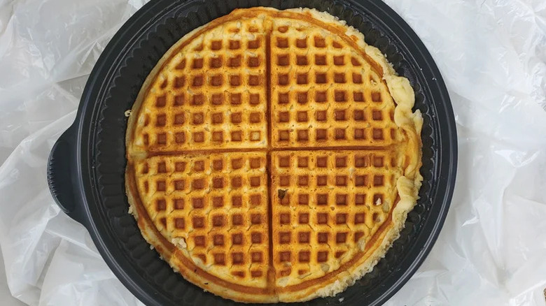 Waffle House waffle in black to-go container