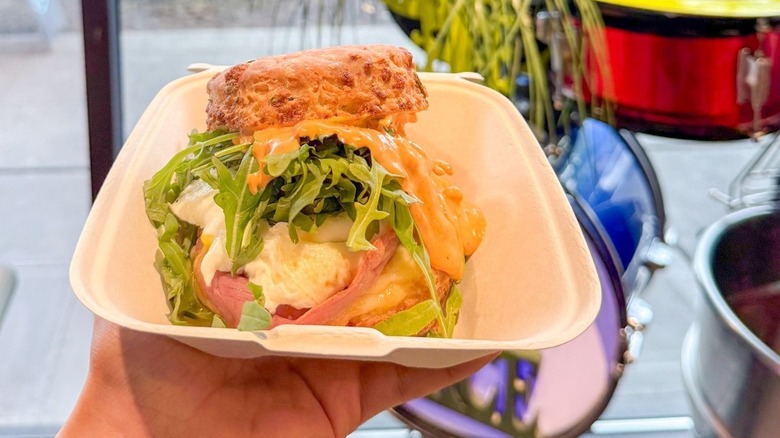 A person holding The Spanish Fly  sandwich at Morsel in Seattle