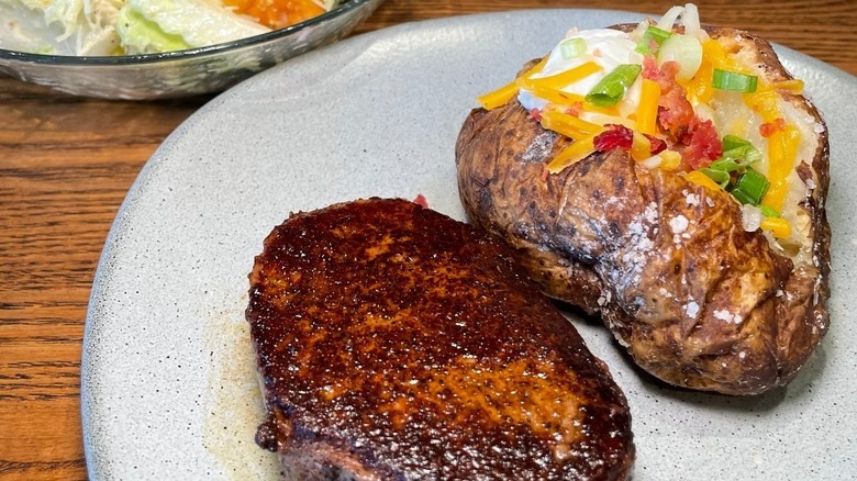 A loaded baked potato from Outback Steakhouse