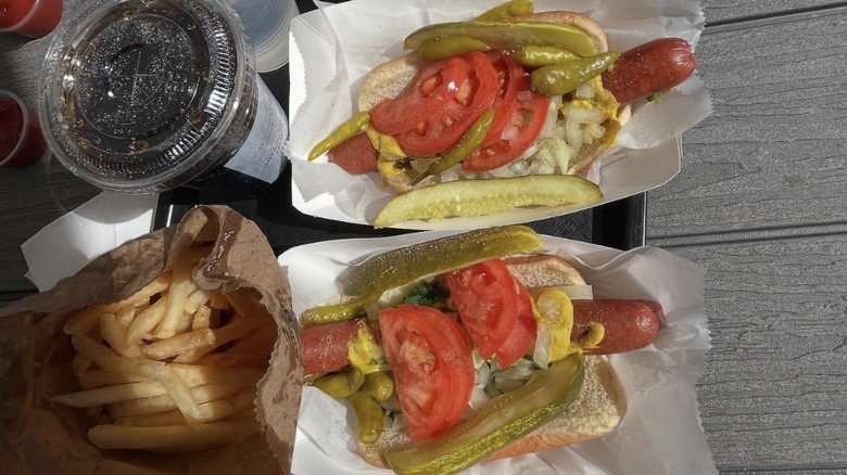 A Byron's hot dog on a tray with fries