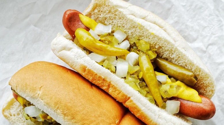 A Chicago style hot dog on white paper from Gene & Jude's