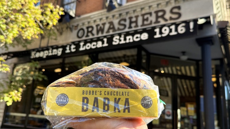 holding a babka outside of Orwashers