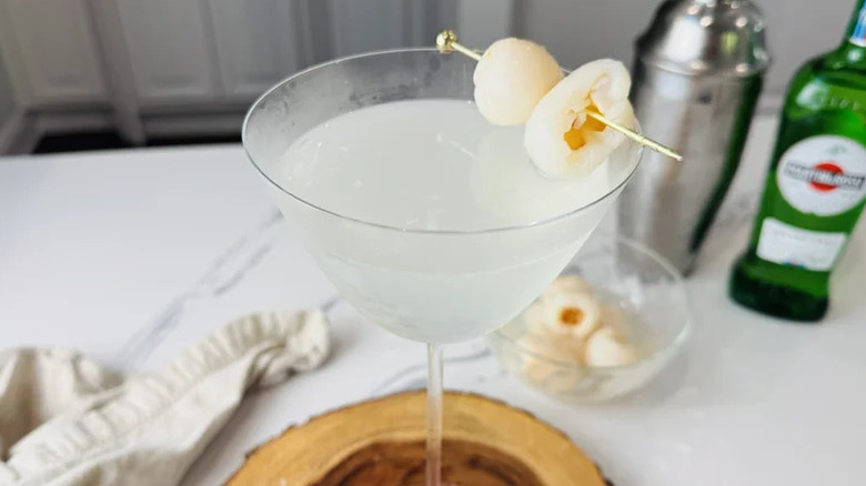 Close up of lychee martini with fresh lychee garnish