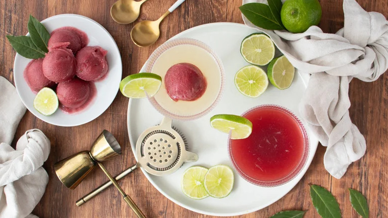 Tequila Cosmopolitan on a white plate with lime garnish