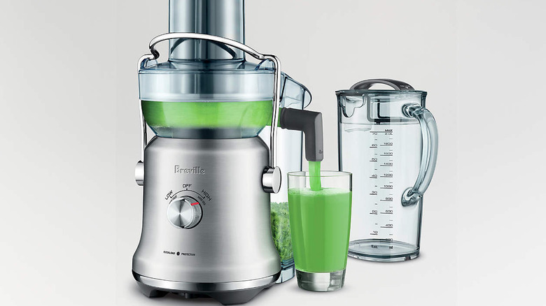 Stainless steel Breville machine making juice