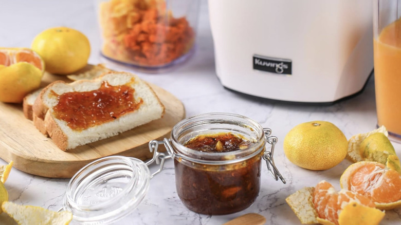 Kuvings Juicer in white kitchen surrounded by food