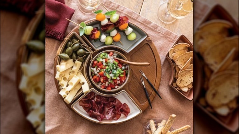 Lazy susan with snacks on a wooden table