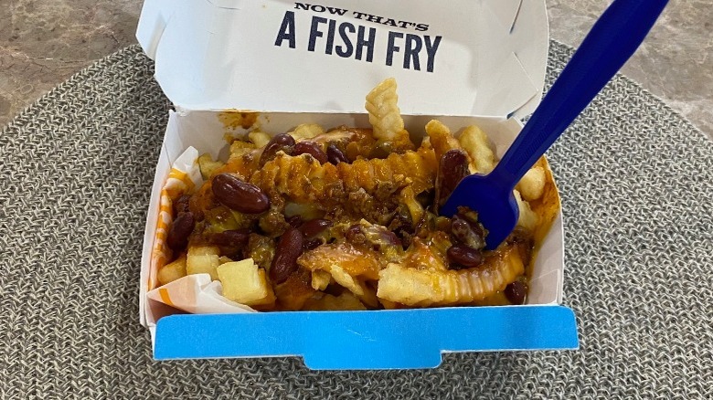 Culver's chili cheddar fries with a fork on the table