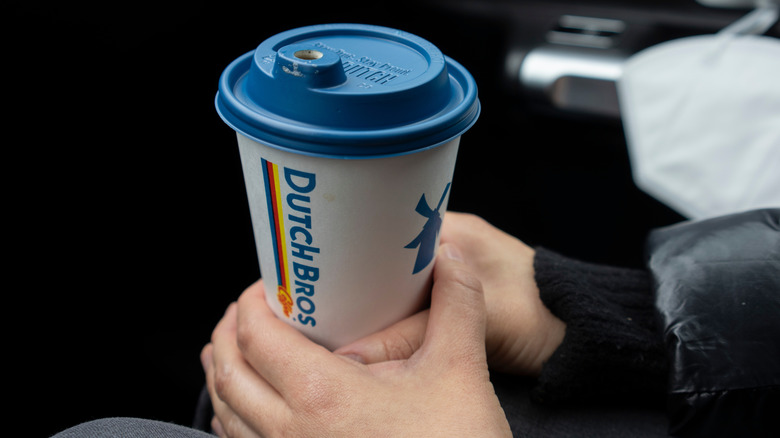 Hands holding Dutch Bros drink