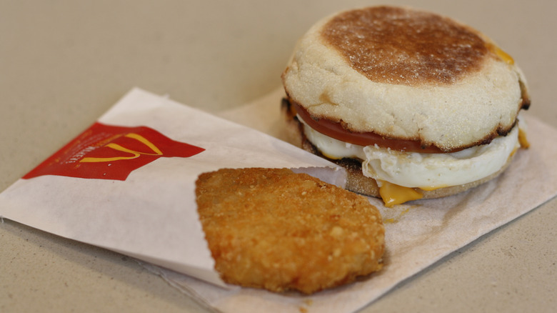 A McDonald's hash brown sits next to an Egg McMuffin
