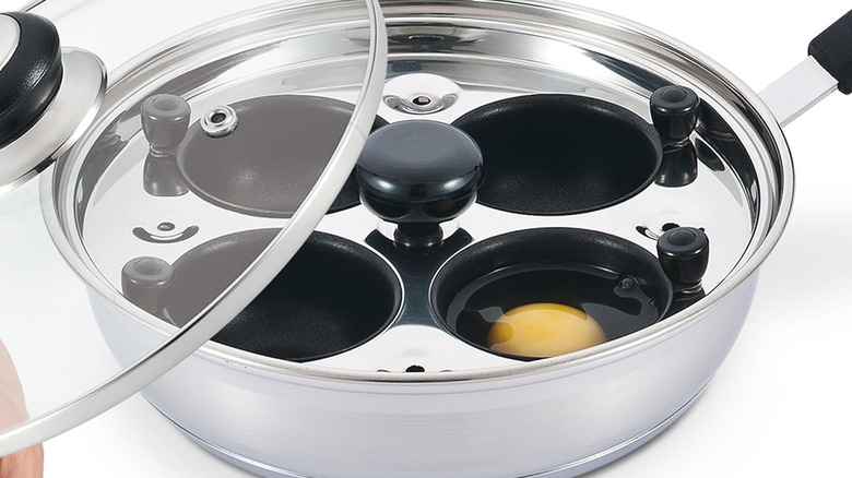 egg poacher pan with one raw egg