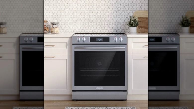 The Frigidaire Gallery 30 in. Electric Range with 15+ Ways To Cook in a cream-colored kitchen