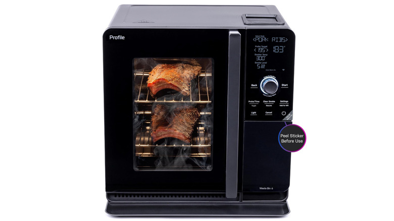smart electric smoker with racks of ribs inside