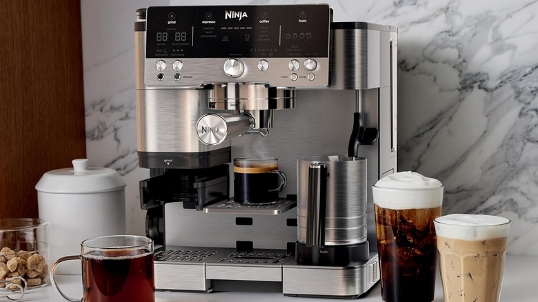 Ninja ﻿Luxe﻿﻿™ Espresso Machine on kitchen counter with marble backdrop