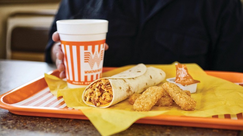 A Taquito with Cheese and hash brown sticks at Whataburger