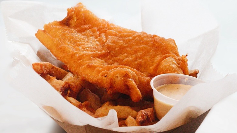 A basket of fish and chip with tartar sauce at A Salt & Battery