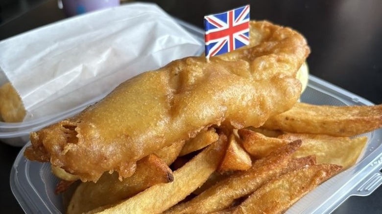 A takeaway container of fish and chips at Aboveground