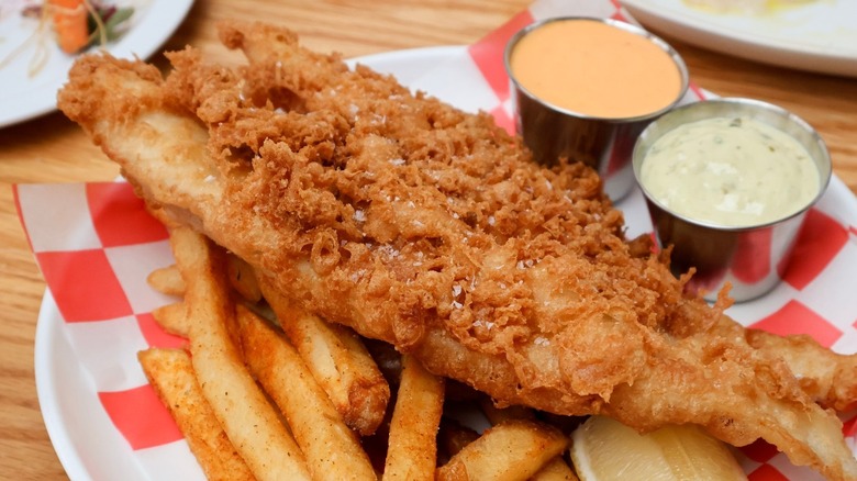 A serving of fish and chips on a plate at Dune Brothers Seafood