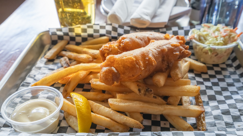 A tray of fish and chips at a restaurant