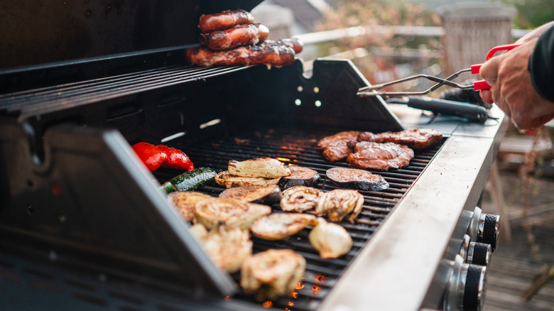 Food cooking on large gas grill