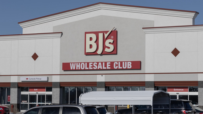 BJ's Wholesale Club exterior with signs with white writing on red backgrounds