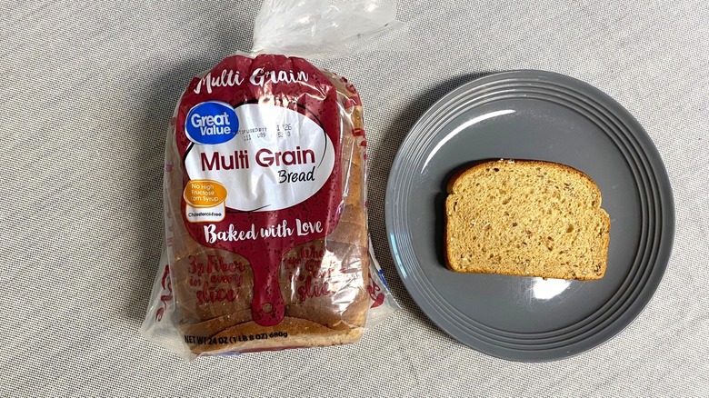A package of Great Value Multi Grain Bread next to a plate with a slice of bread on it
