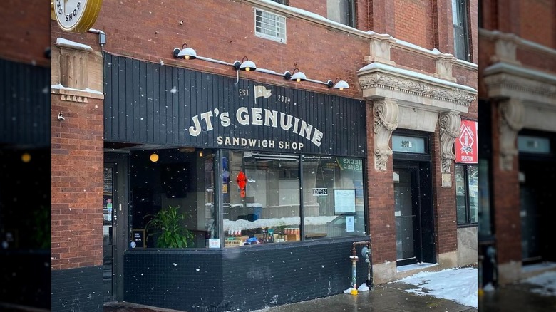 Exterior of JT's Genuine Sandwich Shop with snow falling