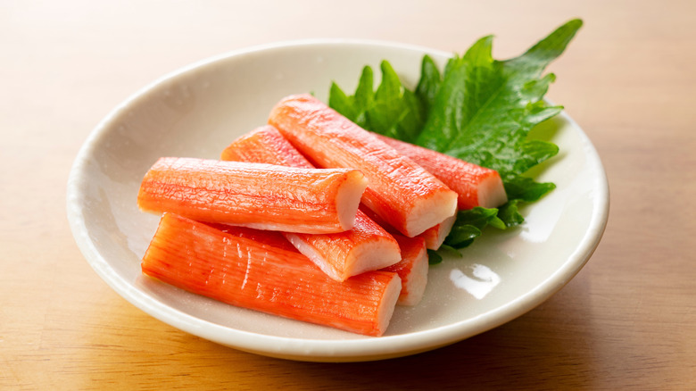 A bowl of imitation crab sticks.