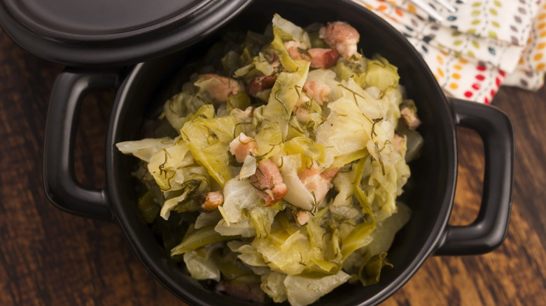 A stew of bacon and cabbage seen from above.