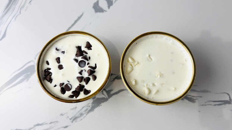 chocolate chips and whipping cream in two bowls