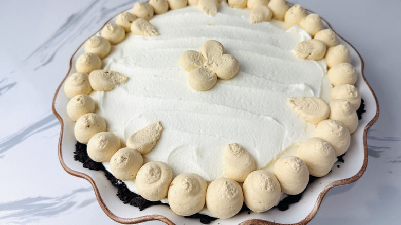 Pie decorated with piped frosting
